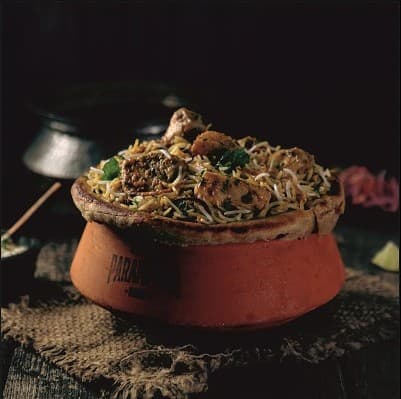 Chicken Dum Biryani with fragrant basmati rice and aromatic spices — Parampara Biryani