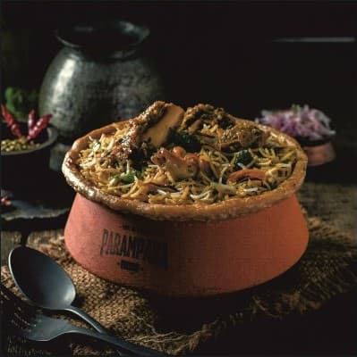 Mutton Dum Biryani served in traditional earthen handi — Parampara Biryani Pune